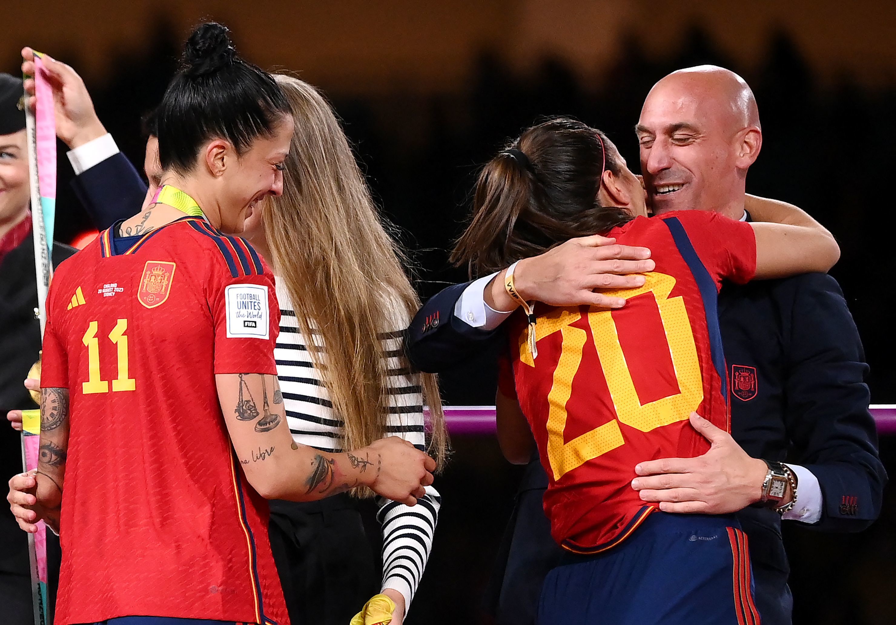 (FILES) Spain's defender #20 Rocio Galvez is congratuled by President of the Royal Spanish Football Federation Luis lt;HIT gt;Rubiales lt;/HIT gt; (R) next to Spain's Jennifer Hermoso after winning the Australia and New Zealand 2023 Women's World Cup final football match between Spain and England at Stadium Australia in Sydney on August 20, 2023. Spain's ex-football federation chief Luis lt;HIT gt;Rubiales lt;/HIT gt; on February 3, 2025 goes on trial in Madrid over his forcible kiss on the lips of player Jenni Hermoso. The 47-year-old provoked worldwide outrage after he cupped Hermoso's head and gave her an unsolicited kiss during the medal ceremony after Spain won the 2023 Women's World Cup in Australia. (Photo by FRANCK FIFE / AFP)