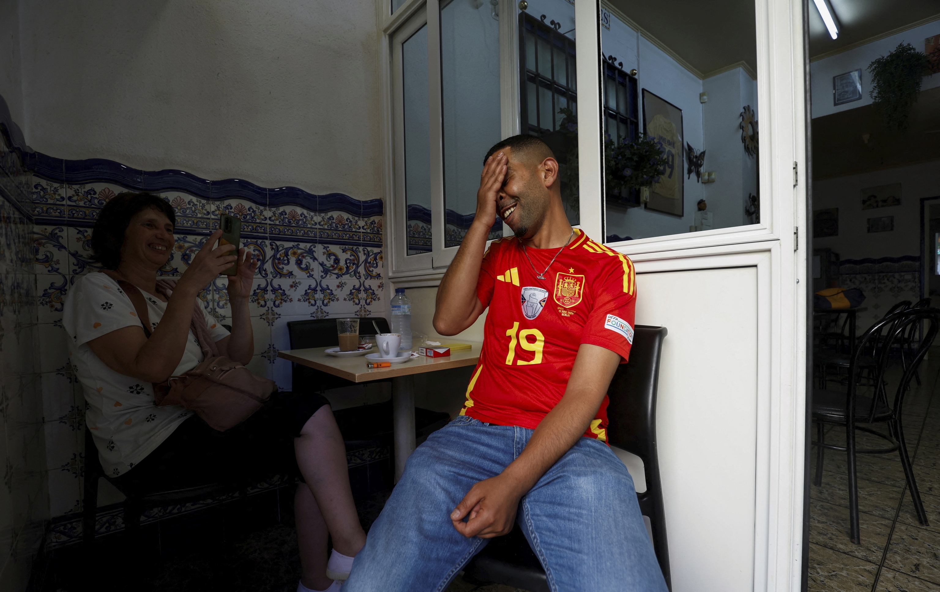 Mounir Nasraoui, father of soccer player lt;HIT gt;Lamine lt;/HIT gt; Yamal, gestures for a picture in Bar El Cordobes at Rocafonda neighbourhood in Mataro, north of Barcelona, Spain, July 11, 2024. REUTERS/ Albert Gea
