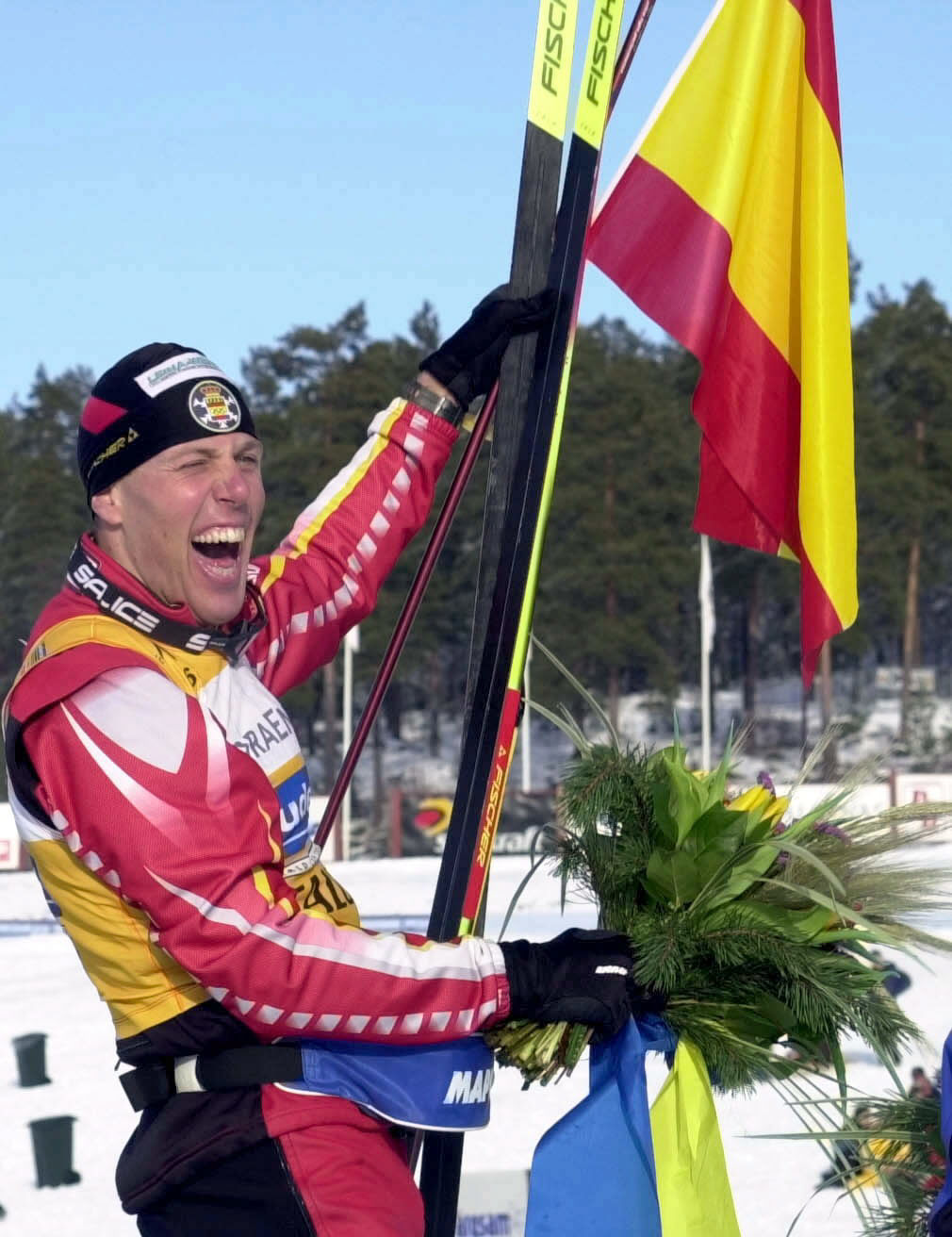 Mühlegg, celebrando sus medallas en Salt Lake City 2002.